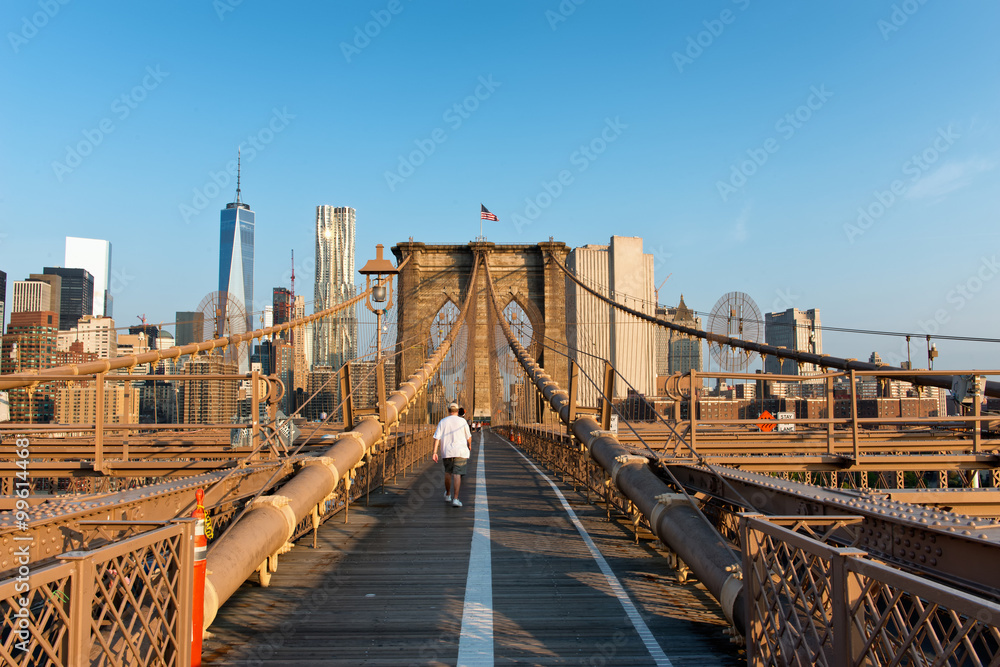 Fototapeta premium Man crossing Boston Bridge pedestrian walkway