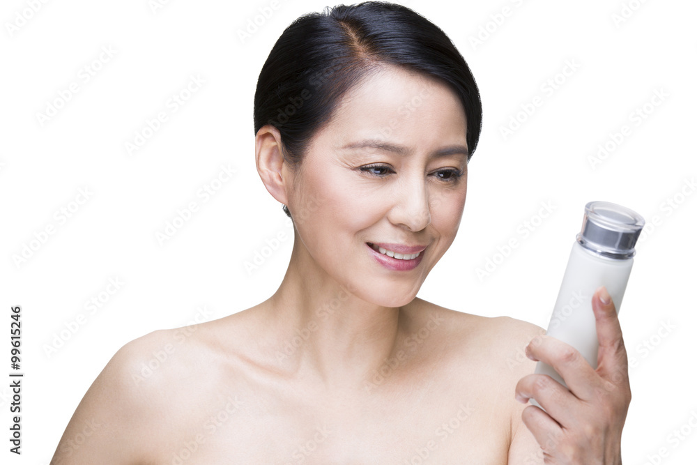 Beautiful mature woman with cosmetic product Beautiful mature woman with cosmetic product