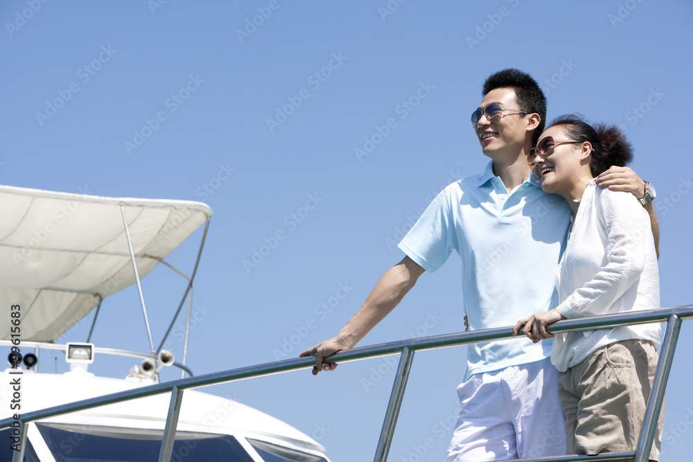 Couple Enjoying the View from the Yacht Deck Couple Enjoying the View from the Yacht Deck