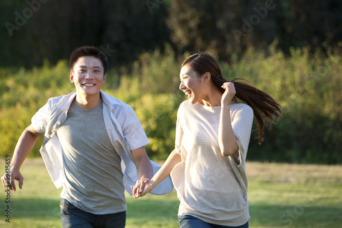 Young couple running in a park