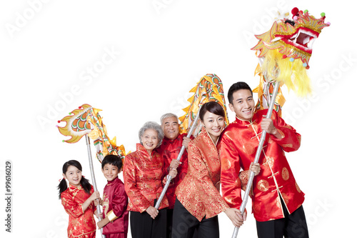 Family Dressed in Traditional Clothing Celebrating Chinese New Year