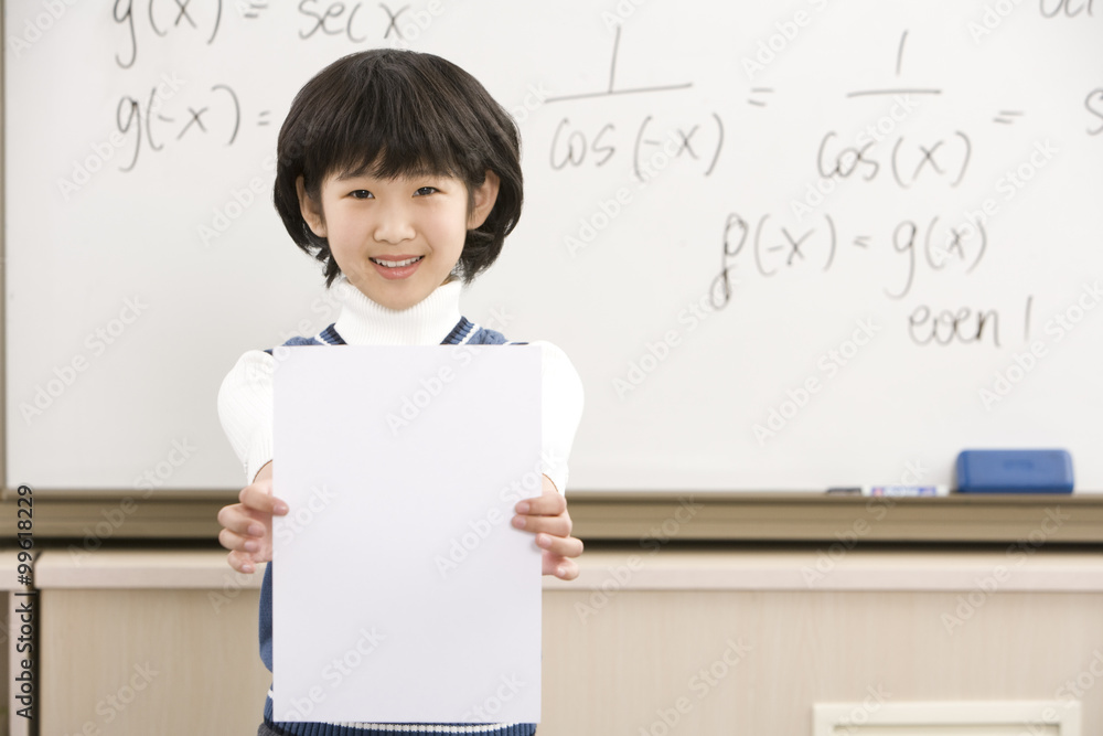 Confident student standing in front of math work Confident student standing in front of math work