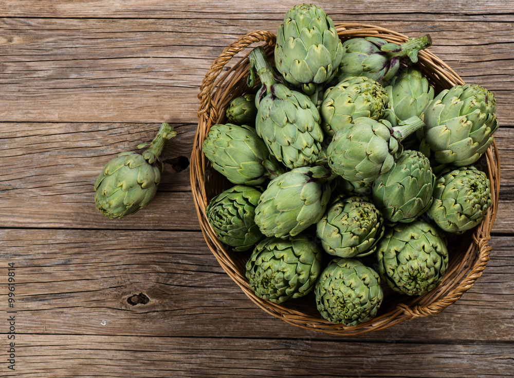 Fresh artichokes on wood, top view. Fresh artichokes on wood, top view.