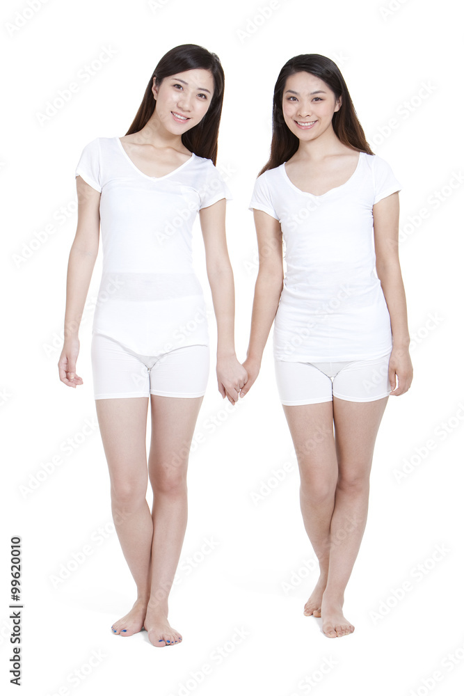 Portrait of best female friends holding hands Portrait of best female friends holding hands