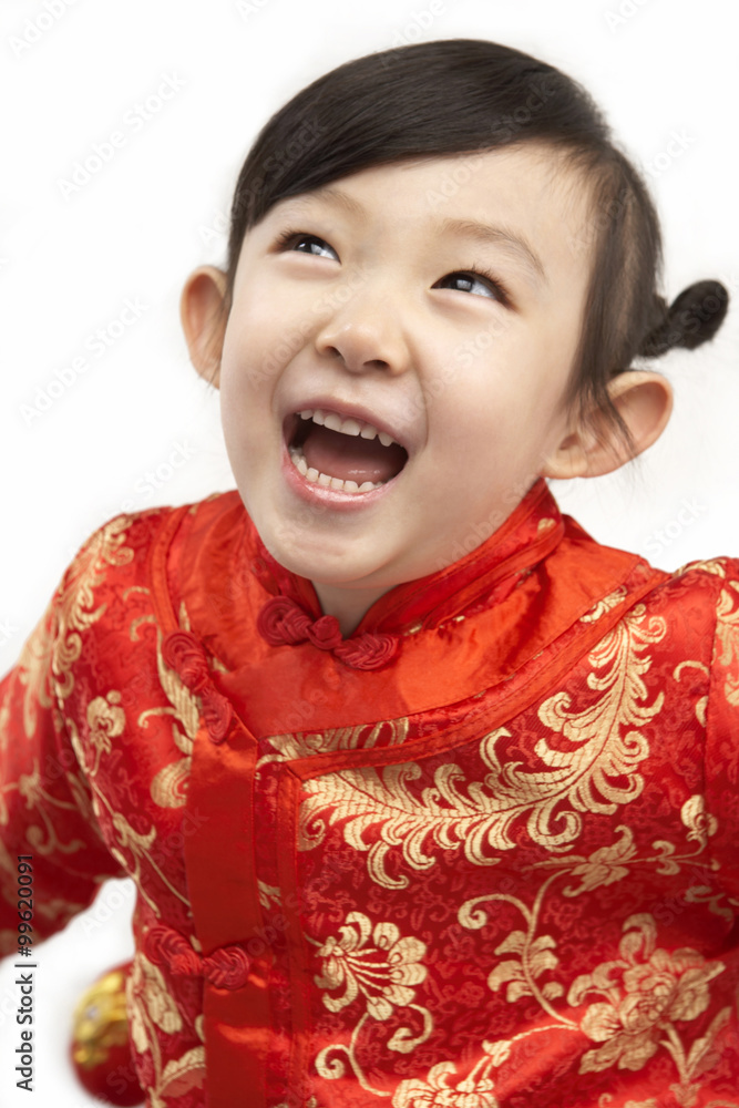 Young girl in festival Chinese New Year clothing, laughing Young girl in festival Chinese New Year clothing, laughing