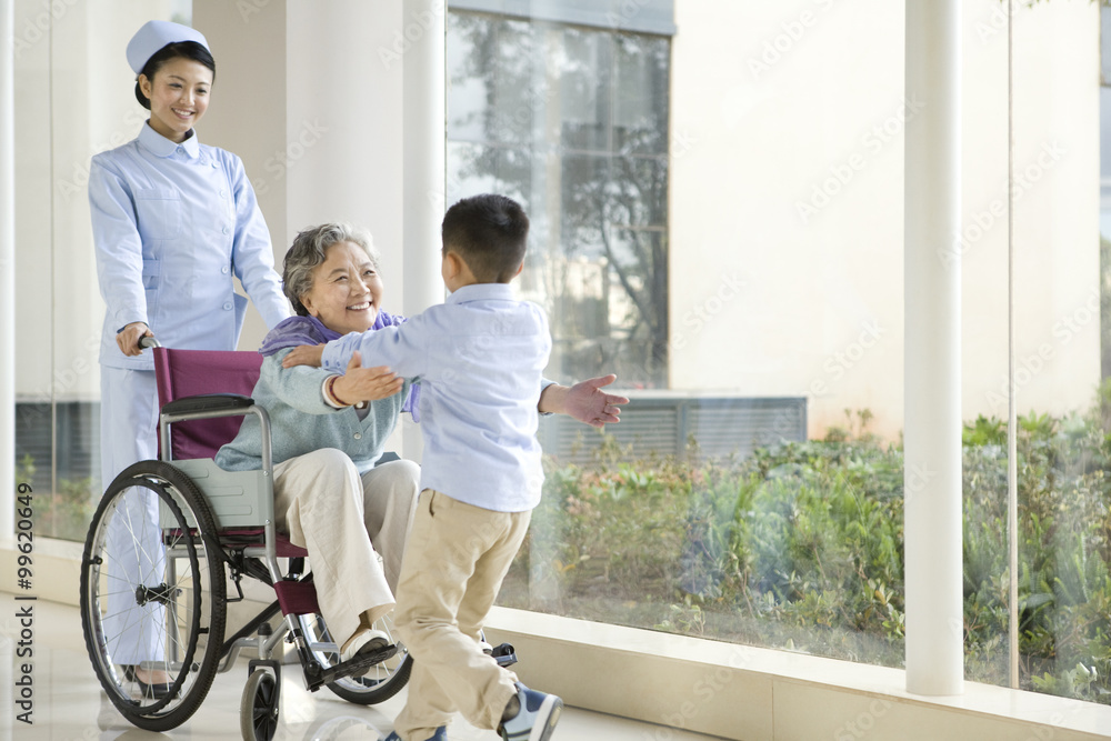 Grandson Runs to Embrace Grandmother in Wheelchair Grandson Runs to Embrace Grandmother in Wheelchair