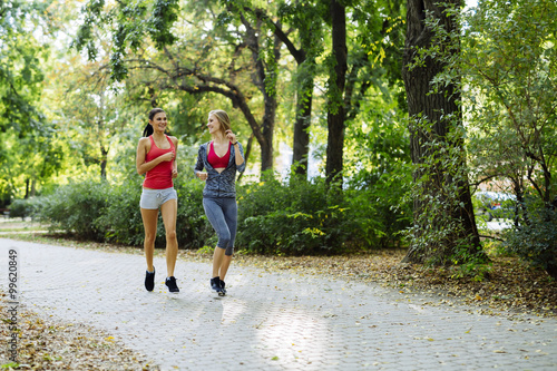 Two young women jogging