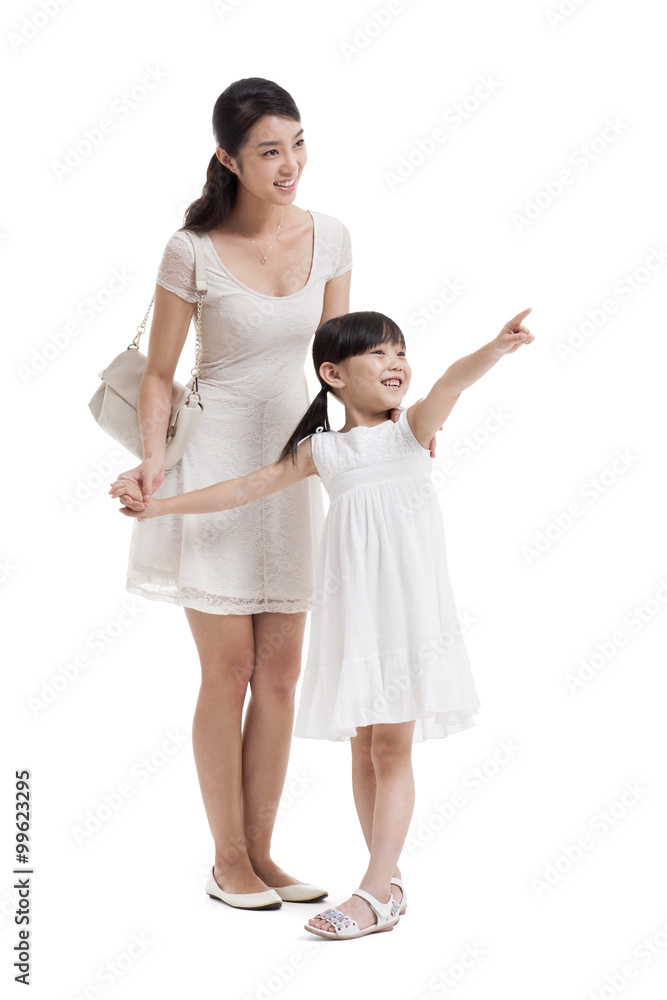 Happy young mother and daughter looking at view