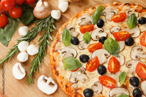 Pizza with mushrooms and ve...