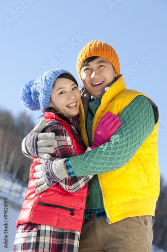 Happy young couple in ski resort