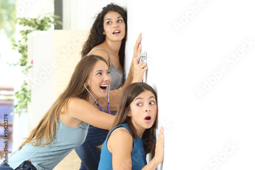 Fototapeta Gossip girls listening to the neighbour