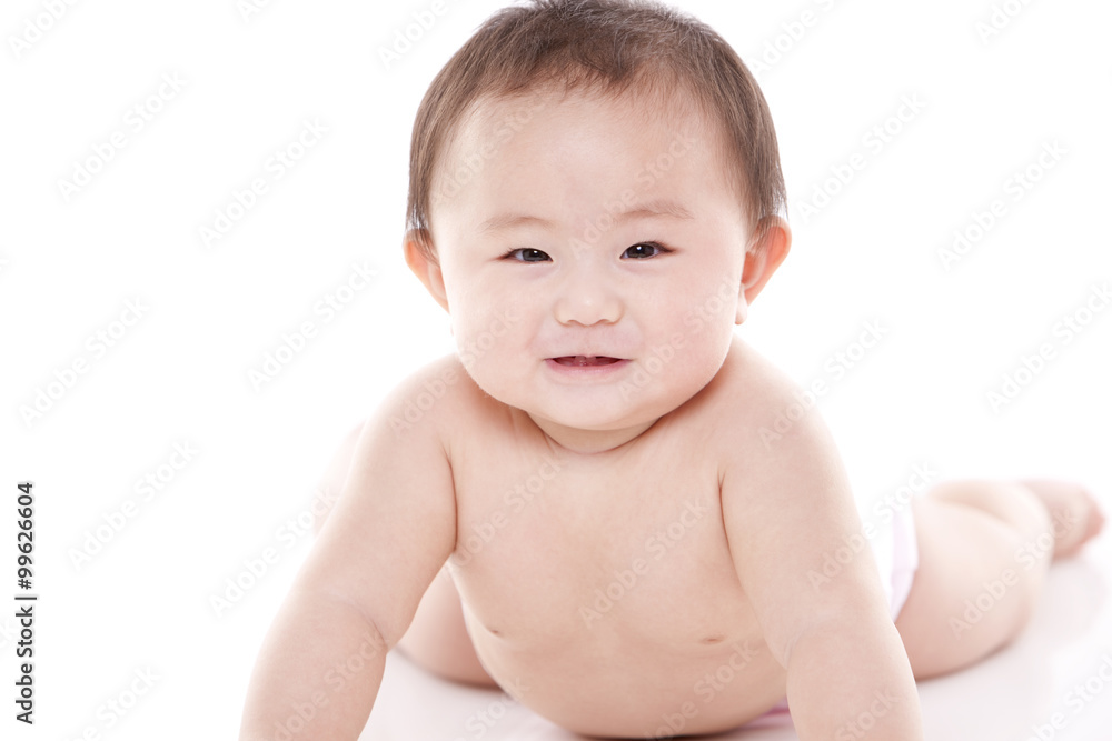 Studio shot of cute baby lying on floor Studio shot of cute baby lying on floor