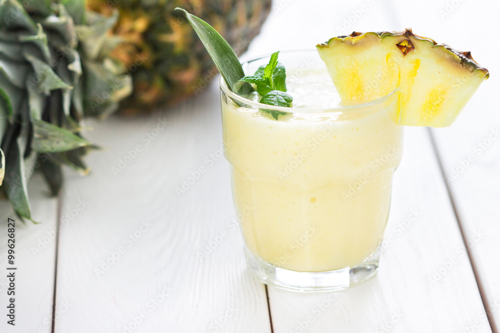Pineapple smoothie with Mint and a Piece of Pineapple, White Background