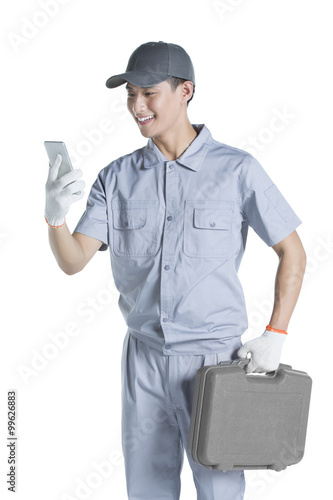Repairman using smart phone