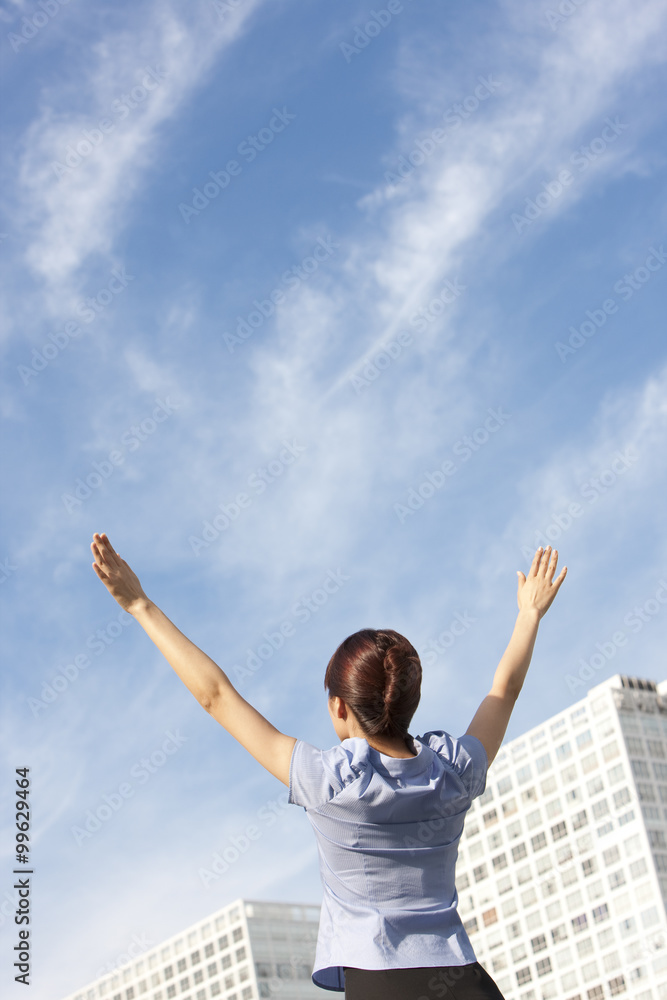Businesswoman Standing with Arms Outstretched Businesswoman Standing with Arms Outstretched