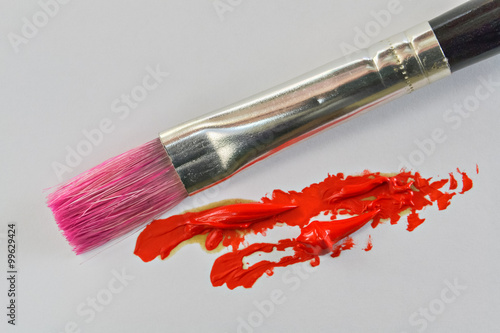 Billede på lærred Paintbrush and red oil color