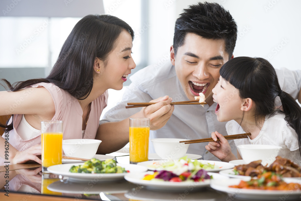 A happy family having lunch together at home A happy family having lunch together at home