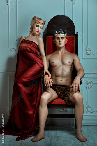 Man king sitting on the throne beside Queen woman.