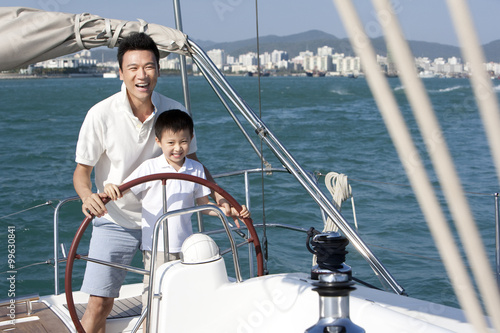 Father and son sailing