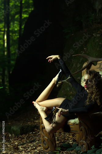 Pretty woman with antlers on shoes photo