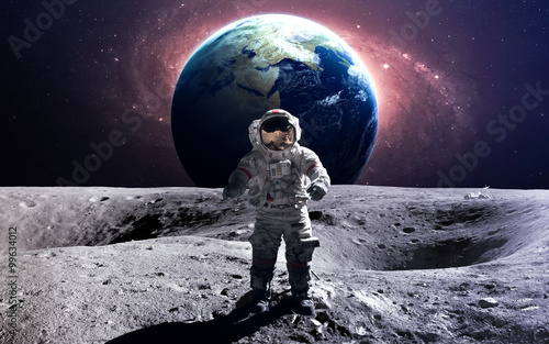 Fototapeta Naklejka Na Ścianę i Meble -  Brave astronaut at the spacewalk on the moon. This image elements furnished by NASA.