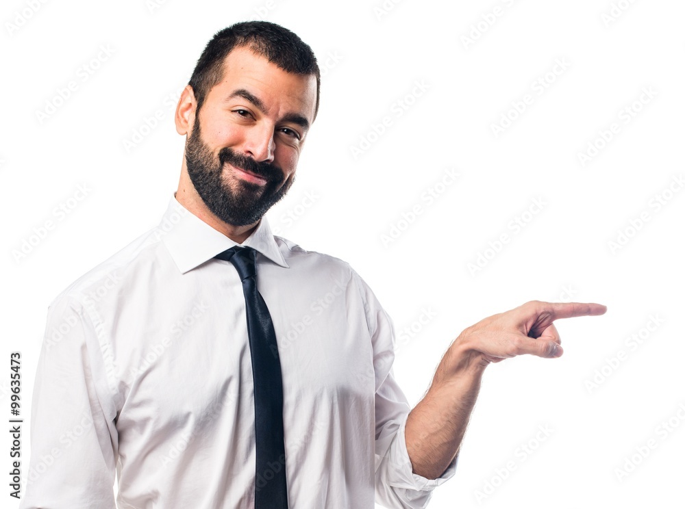 Businessman pointing to the lateral Businessman pointing to the lateral