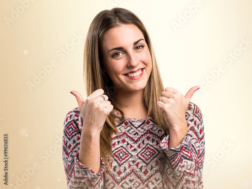 Blonde woman with thumb up