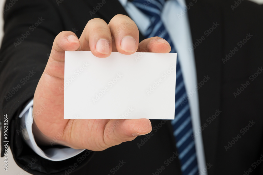 Man hand holding a business card Man hand holding a business card