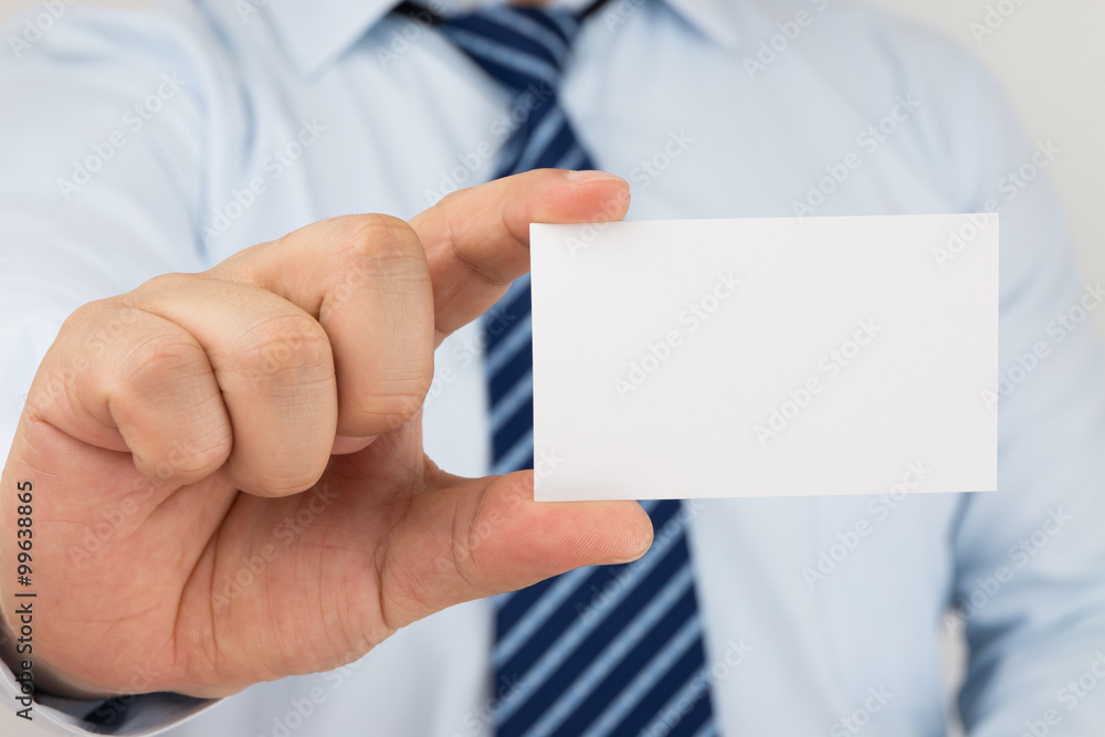 Man hand holding a business card Man hand holding a business card