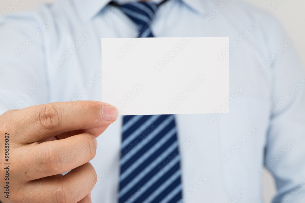 Man hand holding a business card Man hand holding a business card