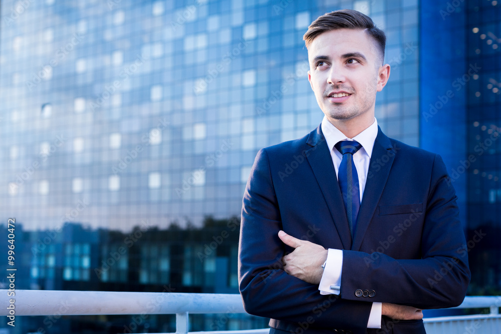 Businessman outside business centre Businessman outside business centre