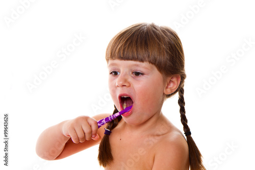 dental hygiene. happy little girl brushing her teeth