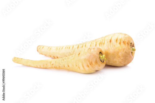 Fresh parsnip roots on a white background