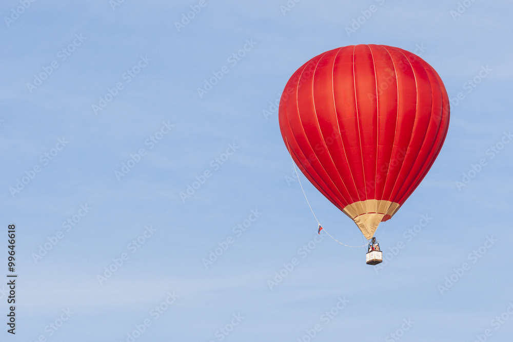 Naklejka premium Air Balloon Levitating Over the Crowd of People Standing Outdoors