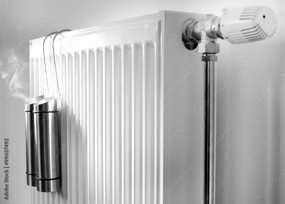 Steam from metal containers on radiator Stock Photo | Adobe Stock