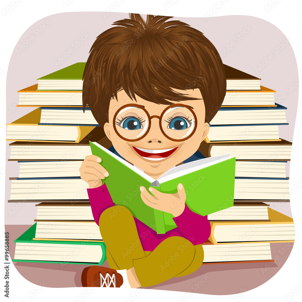 little boy with glasses reading an interesting book