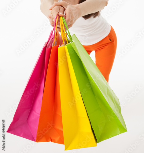 Young woman with multicolored shopping bags
