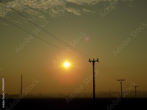 Power line and sunset