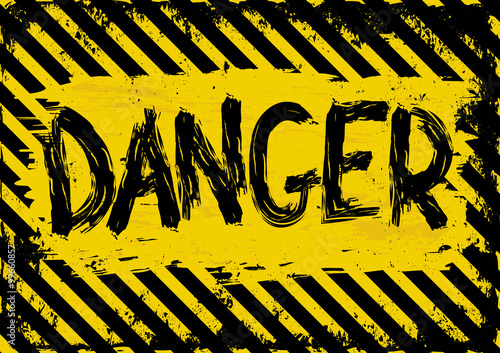 grunge background with yellow and black danger symbol