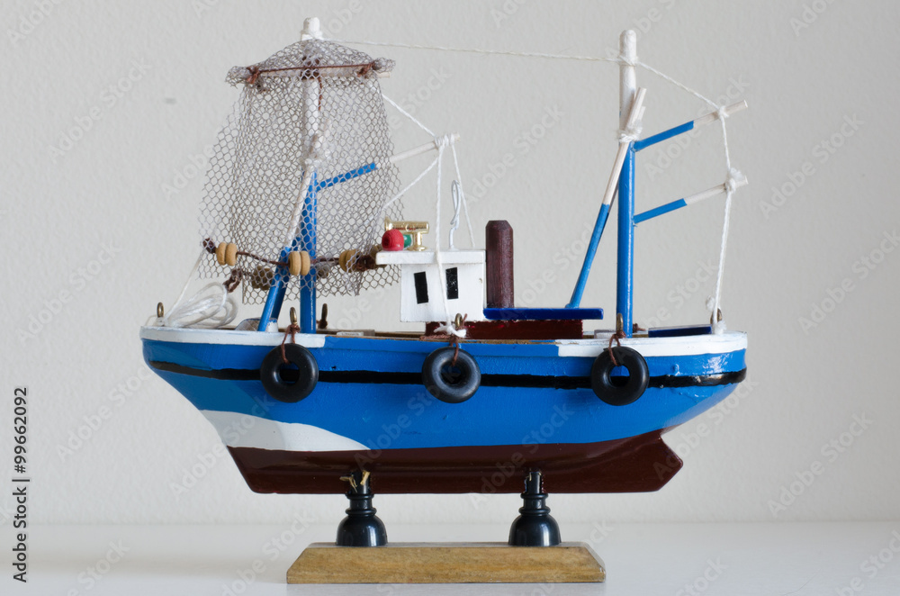 Blue toy fishing boat with white background Stock Photo