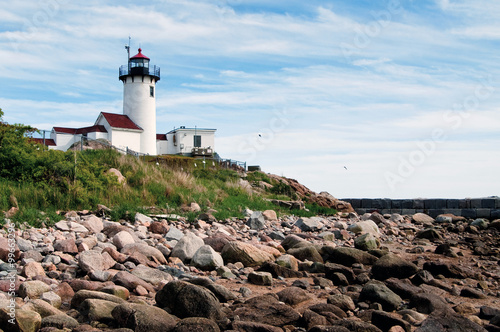 Gloucester Harbor Lighthouse Over Rocky Shore in Low Tide. The Lighthouse was Built to Protect Mariners from the Rocky Shore.