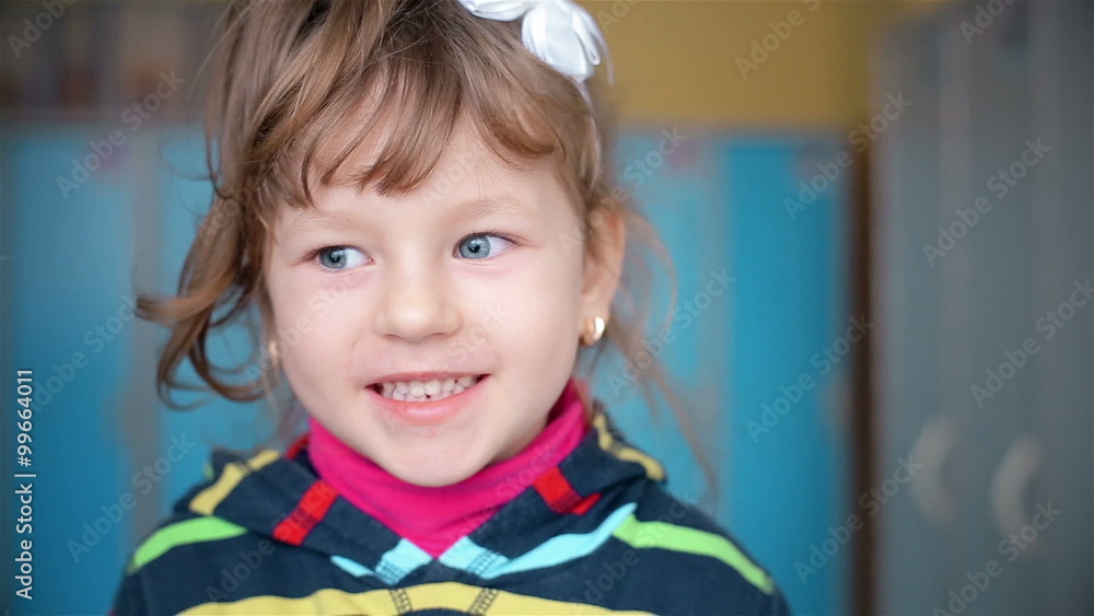 Portrait of a child who looks into the camera Portrait of a child who looks into the camera