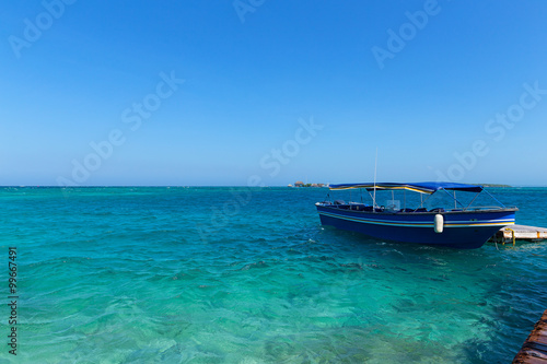 Tourist motorboat near del Rosario Islands, Colombia. Del Rosario Islands archipelago known as coral islands.