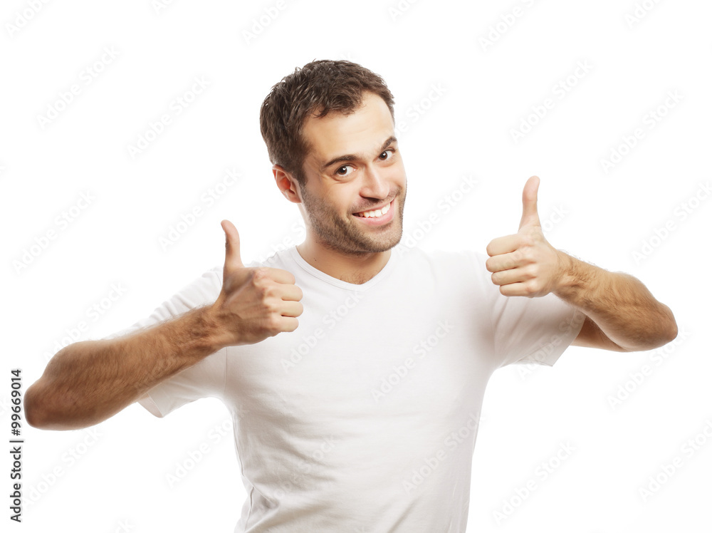 Happy handsome man showing thumbs up Happy handsome man showing thumbs up