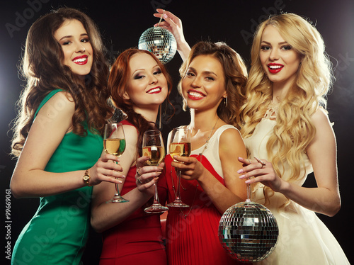 party girls clinking flutes with sparkling wine