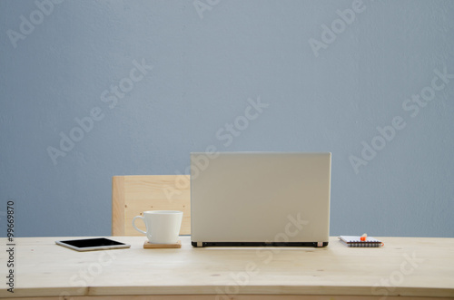 Office desk with notepad  notebook  orange pencil and coffee cup