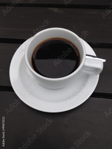 coffee cup on the black table
