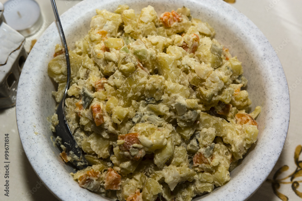 potato salad in a bowl with a spoon potato salad in a bowl with a spoon