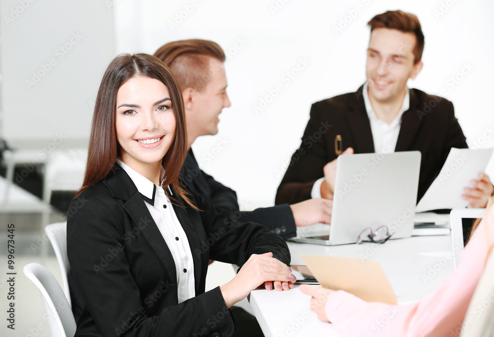Photo of business woman with her staff in conference room at the meeting Photo of business woman with her staff in conference room at the meeting