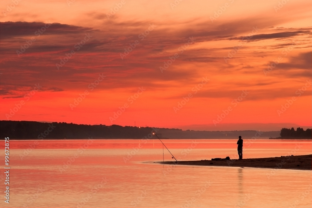 Fisherman silhouette at sunset